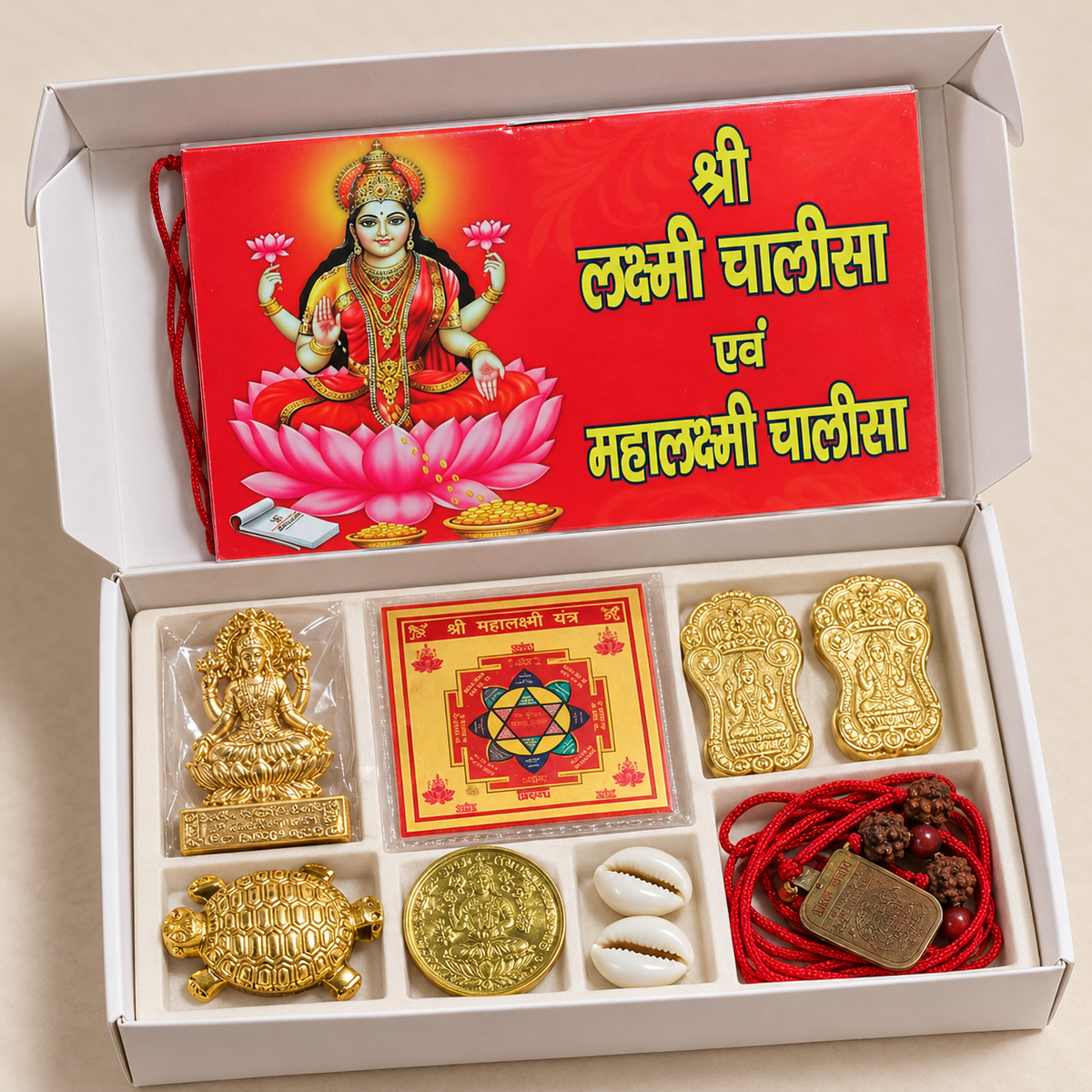 Shubh Lakshmi Samriddhi Kit with Lakshmi idol, Mahalakshmi yantra, two white cowrie shells and puja accessories in a box