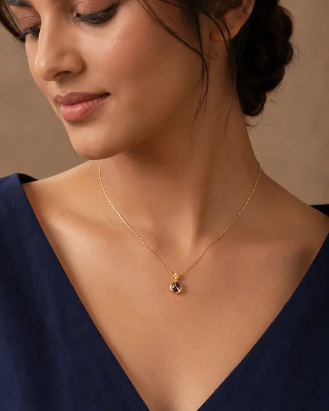 Female model wearing original gold gemstone pendant